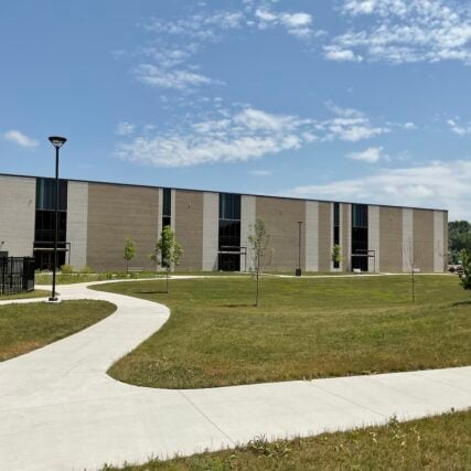 A view of the walkway leading to the Greater Midland Community Center highlights Boettcher Masonry’s durable brick veneer and precise craftsmanship.