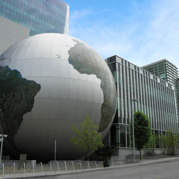 Exterior of Nature Research Center in North Carolina featuring Boettcher Masonry work and a globe sculpture at the entrance.