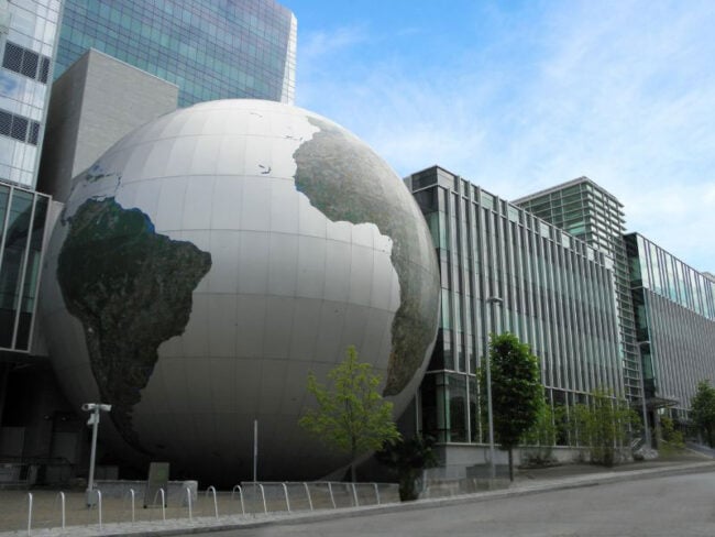 Exterior of Nature Research Center in North Carolina featuring Boettcher Masonry work and a globe sculpture at the entrance.