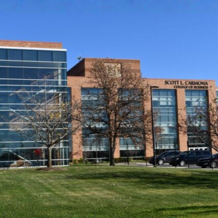 Side view of Saginaw Valley State University’s Scott L. Carmona College of Business from the green yard, featuring Boettcher Masonry’s brick and glass exterior.