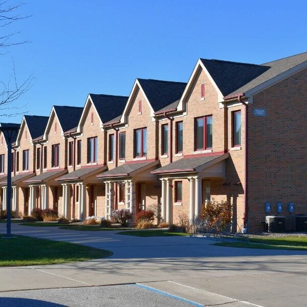 Saginaw Valley State University – Student Housing Main Exterior of Saginaw Valley State University Student Housing featuring brick veneer buildings with pillars and residential-style architecture by Boettcher Masonry.